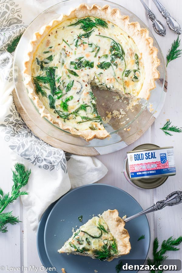 Fully baked salmon spinach quiche, sliced and ready to serve.