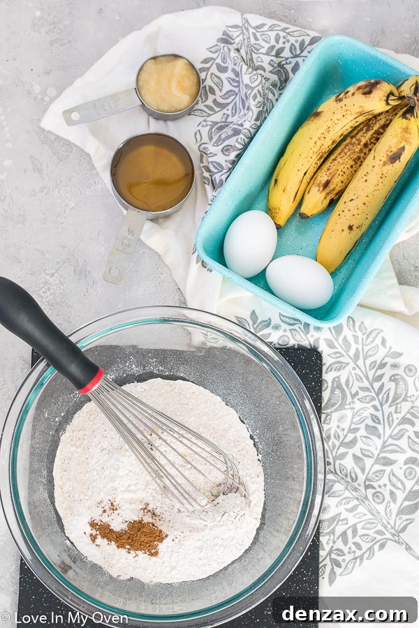 mashed bananas and wet ingredients for healthy banana bread