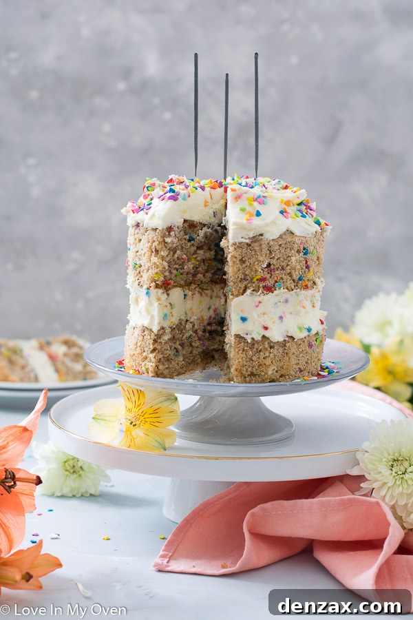 Close-up of a slice of healthy birthday cake, showing its moist texture and vibrant sprinkles, ready for a guilt-free celebration.