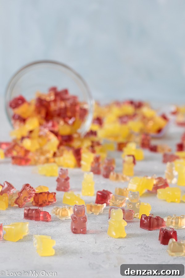 close-up of colorful homemade gummy bears on a white surface