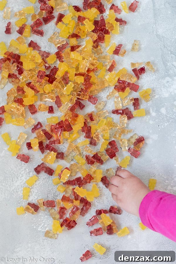 child's hand reaching for homemade gummy bears