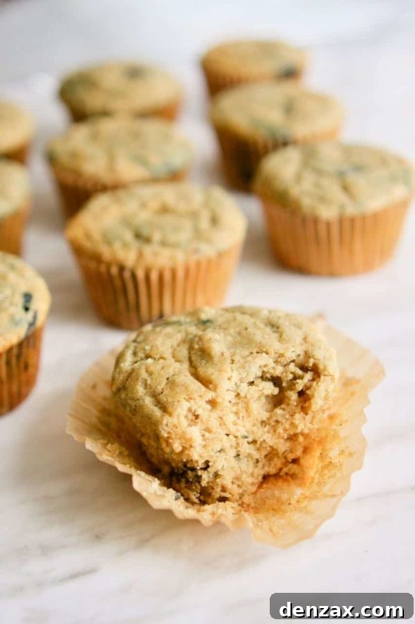 Delicious Blueberry Banana Sourdough Muffins, golden brown and bursting with fruit.