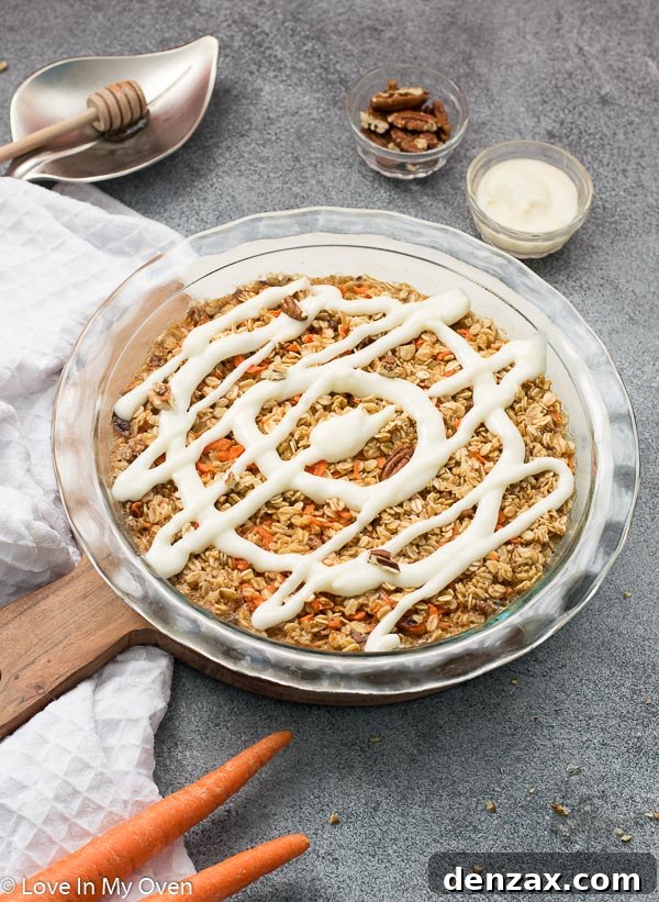 Healthy Carrot Cake Baked Oatmeal topped with cream cheese icing