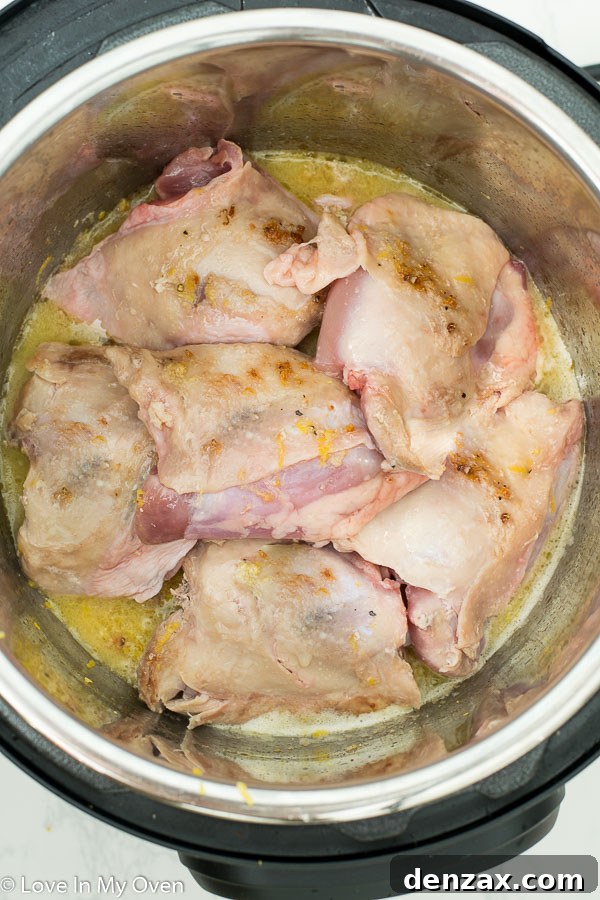 Finished Instant Pot Lemon Garlic Chicken Thighs served with rice.