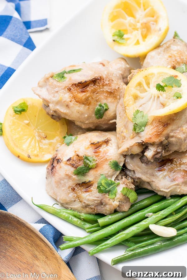Overhead shot of Instant Pot Lemon Garlic Chicken Thighs in a serving dish.