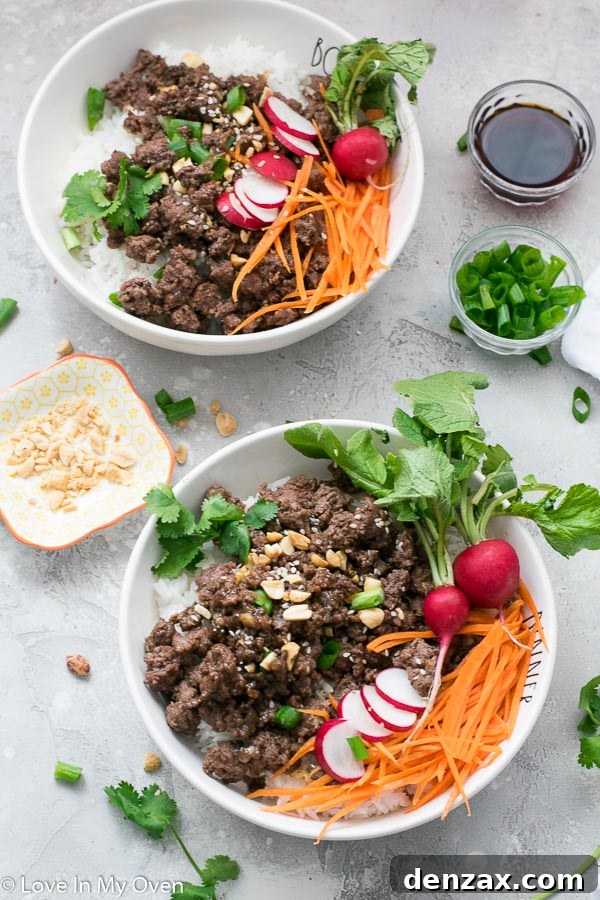Hoisin Beef Bowls garnished with green onions and peanuts