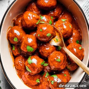 A white serving deep dish of meatballs with a spoon.