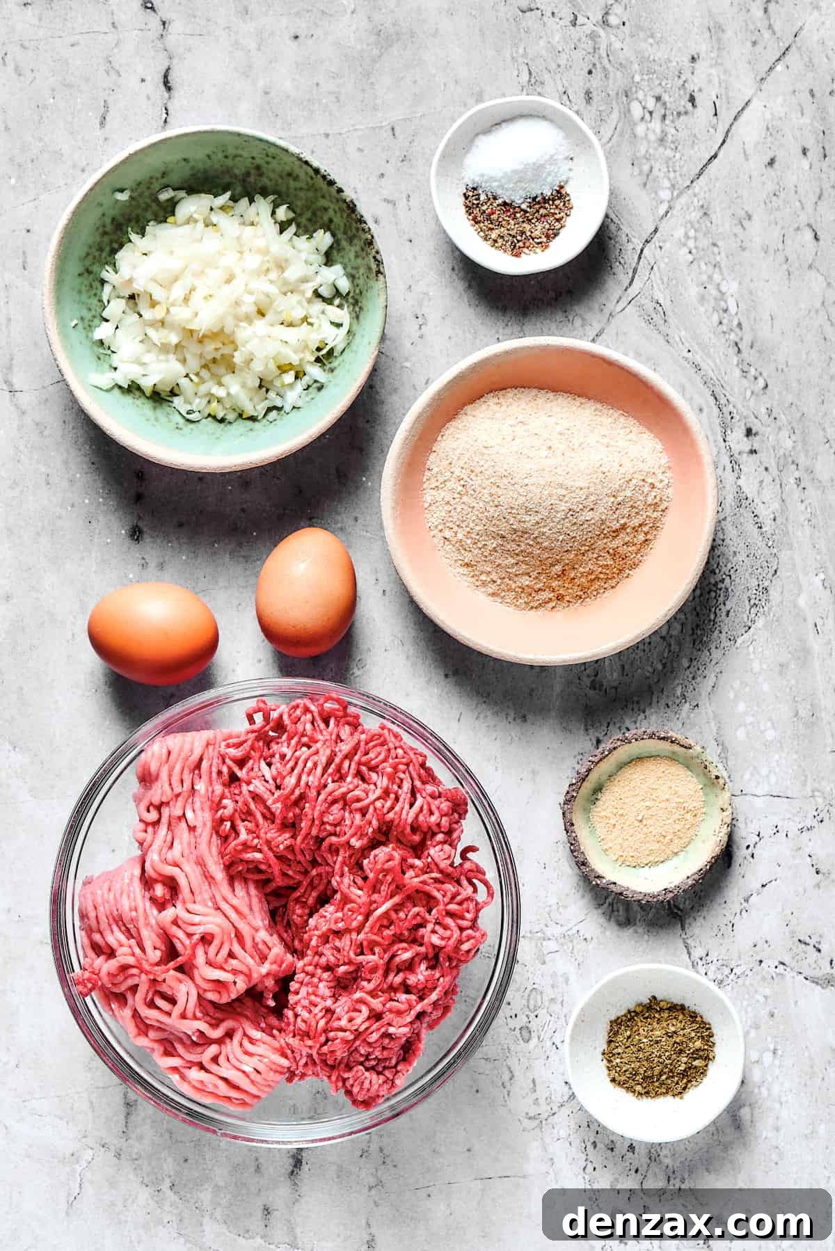 From top left: Onion, salt and pepper, eggs, breadcrumbs, ground beef and ground turkey, garlic powder, Italian seasoning.