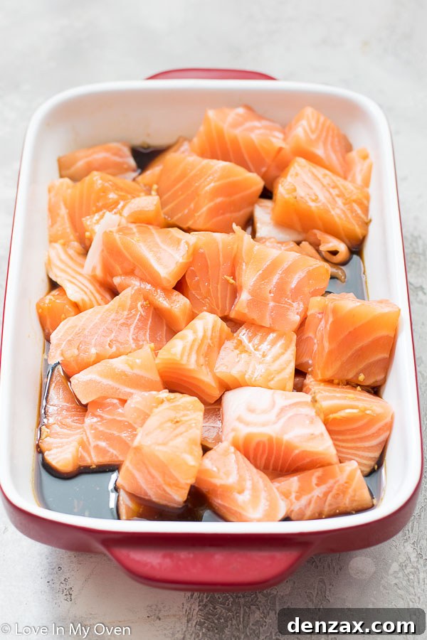 Salmon cubes marinating in teriyaki sauce