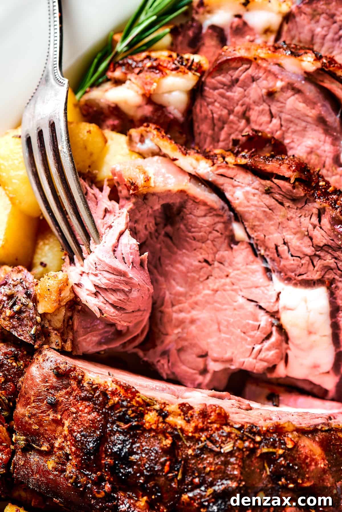 A fork serving a slice of rib roast.