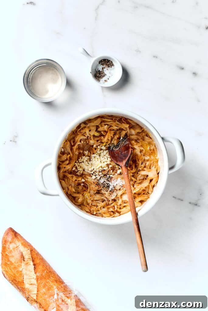 Caramelized onions and minced garlic cooking together in a pot.