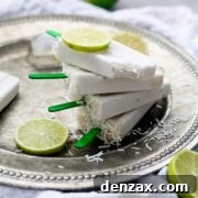 Delicious homemade coconut lime popsicles with a crispy coconut topping.