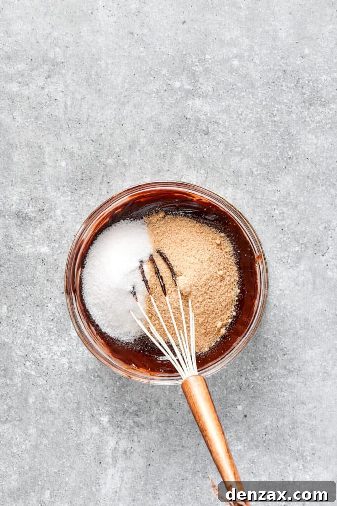 Marbled Chocolate Cheesecake Brownies 4 Thoroughly whisking sugar into the brownie mixture for a smooth, uniform batter.