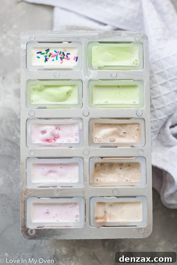 popsicle molds with ice cream and sticks