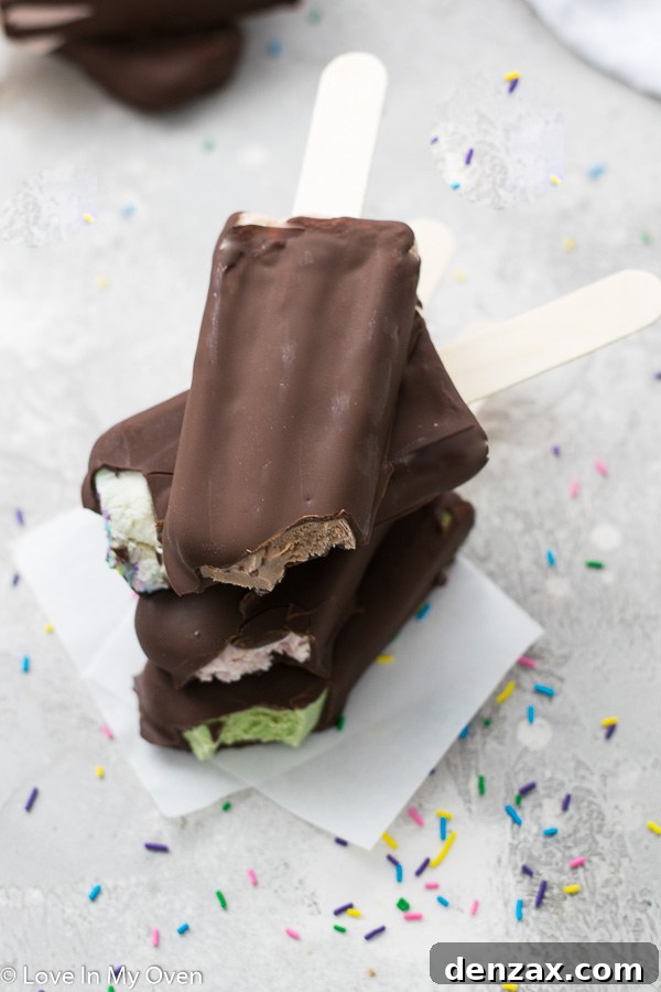 chocolate dipped ice cream bars on a tray
