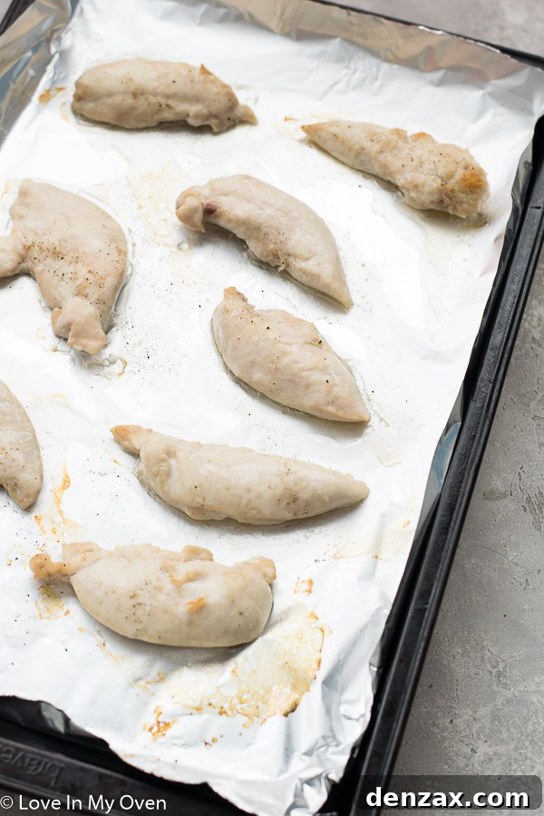 Chicken tenders cooking under the broiler for stir fry