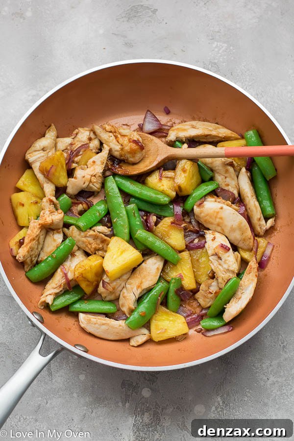 Finished Chicken and Pineapple Stir Fry served over rice