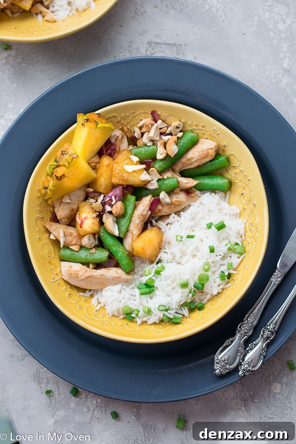 Overhead shot of Chicken and Pineapple Stir Fry with chopsticks