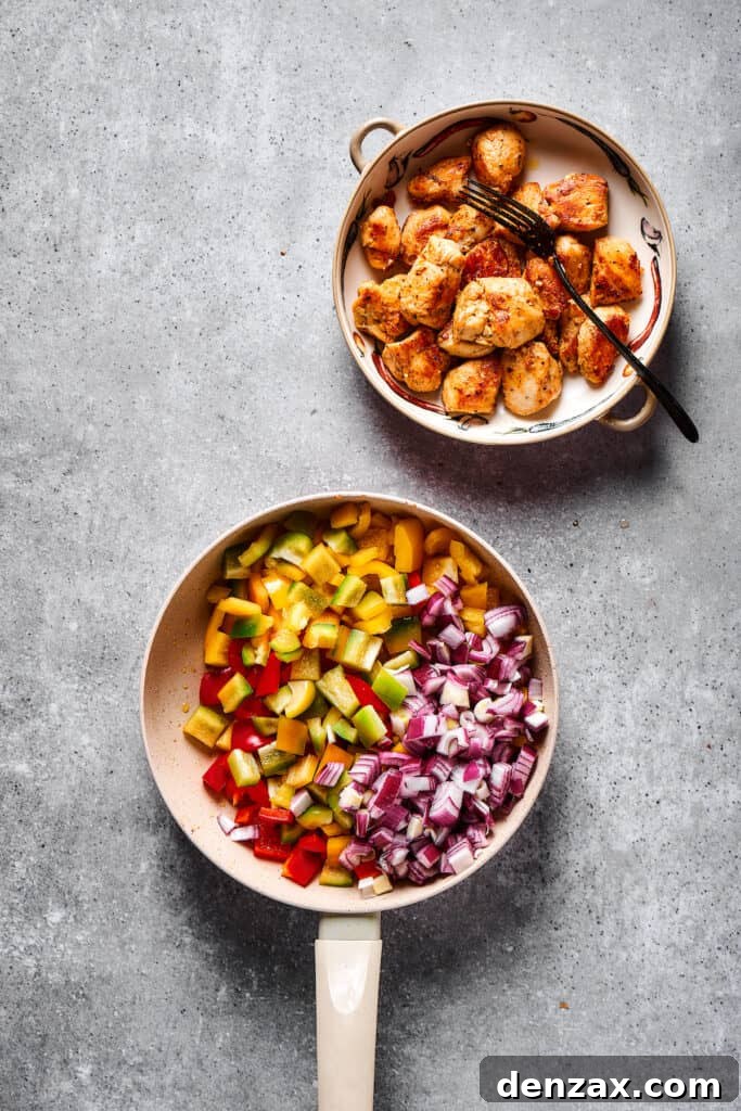 This Chicken Fajita Pasta, prepared with tender veggies and juicy chicken, makes the perfect dinner for family night or a casual get-together with friends. Chopped vegetables in a skillet next to a bowl of cooked chicken.