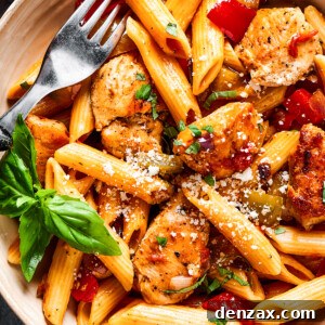 Creamy Chicken Fajita Pasta 2 overhead close up of chicken and penne with tomatoes, peppers, and onions.