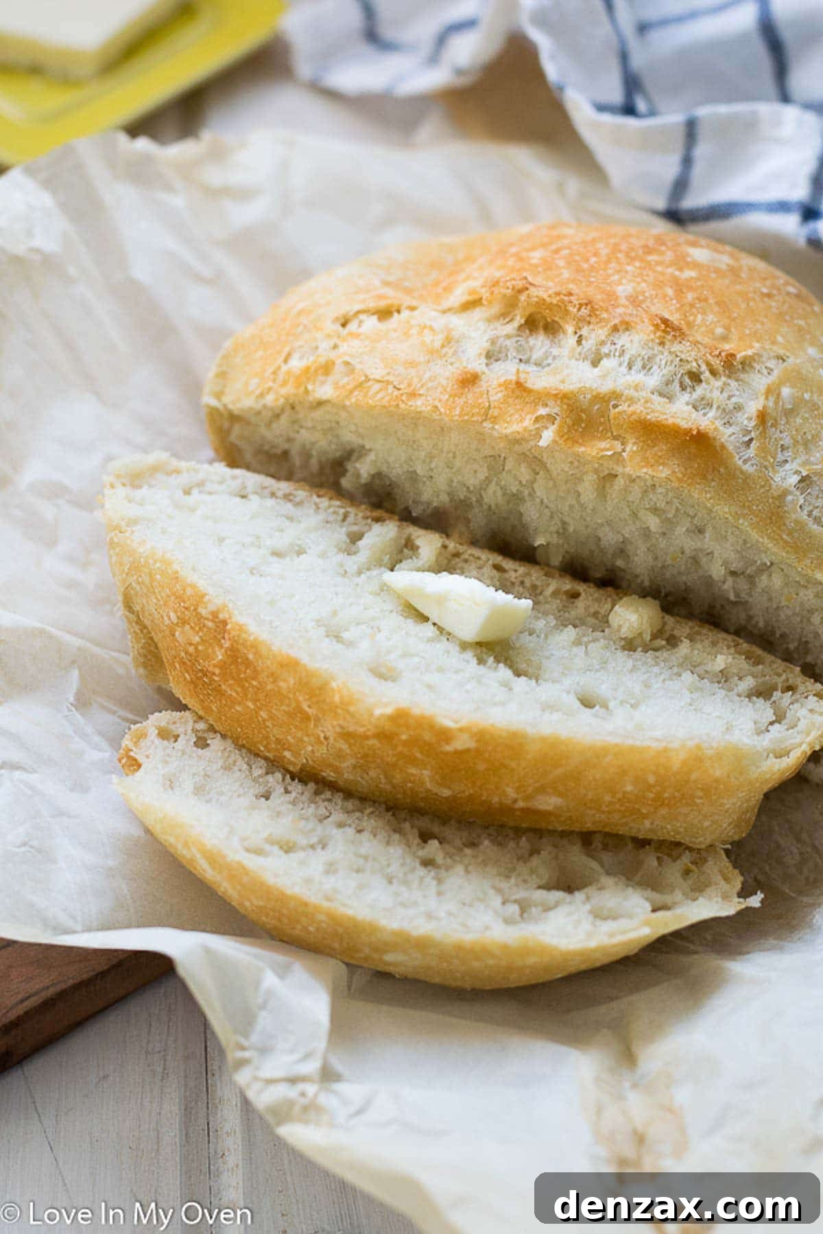 Crusty, golden-brown no-knead 3-ingredient bread on a cooling rack, fresh from the oven.