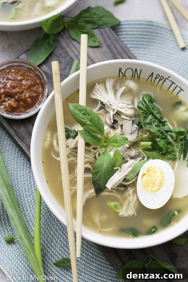 A vibrant bowl of turkey ramen with chopsticks