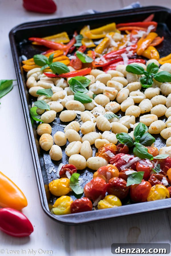 Close-up of crispy sheet pan gnocchi and roasted colorful vegetables