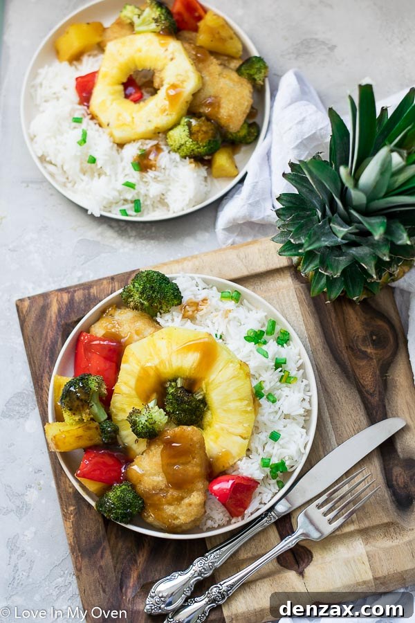 teriyaki-style sheet pan meal with fish and vegetables served over rice