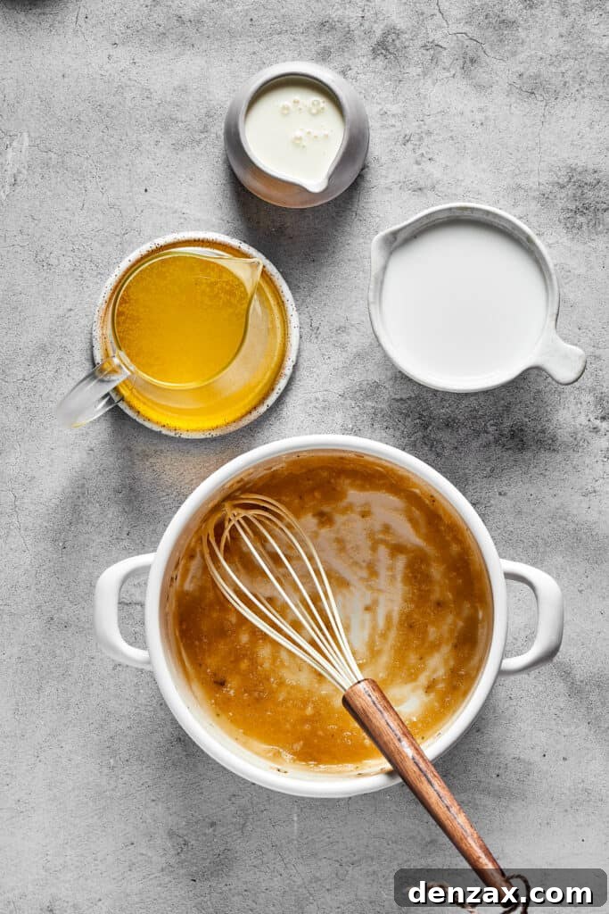 Whisking heavy cream into a simmering sauce, creating a smooth and rich texture.