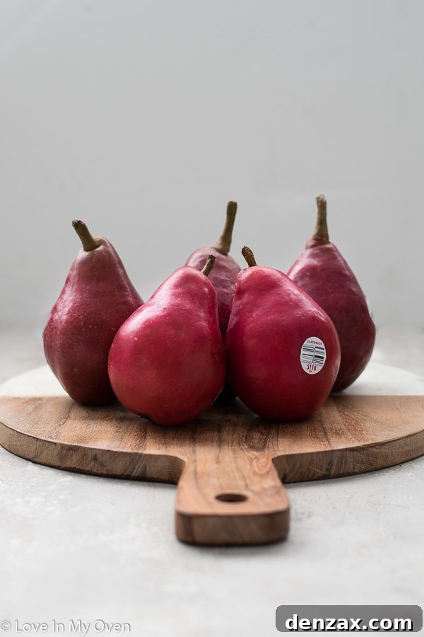 Pear and goat cheese pizza slices on a cutting board