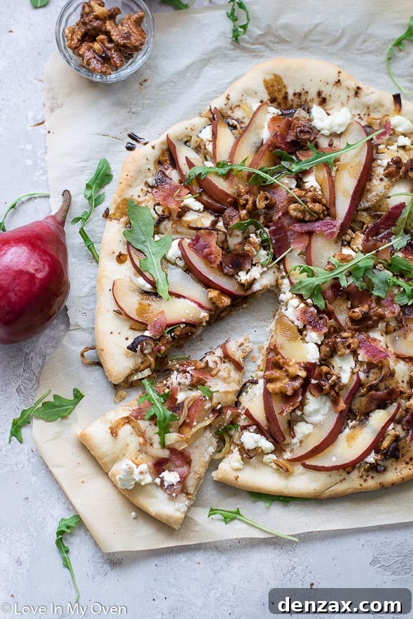 Baked pear and goat cheese pizza coming out of oven