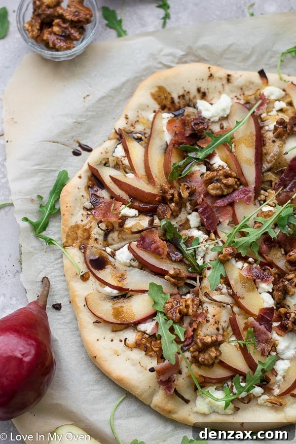 Pear and goat cheese pizza with balsamic glaze and arugula