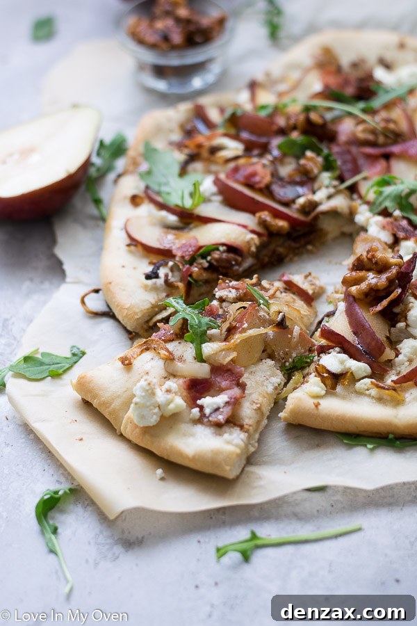 Close up view of pear and goat cheese pizza slice