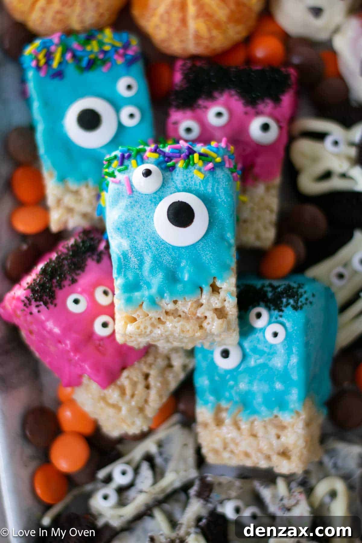 Spooky Sweet Creations for Kids 9 Colorful Rice Krispie Monsters decorated with candy melts and various candy eyeballs on a Halloween background.