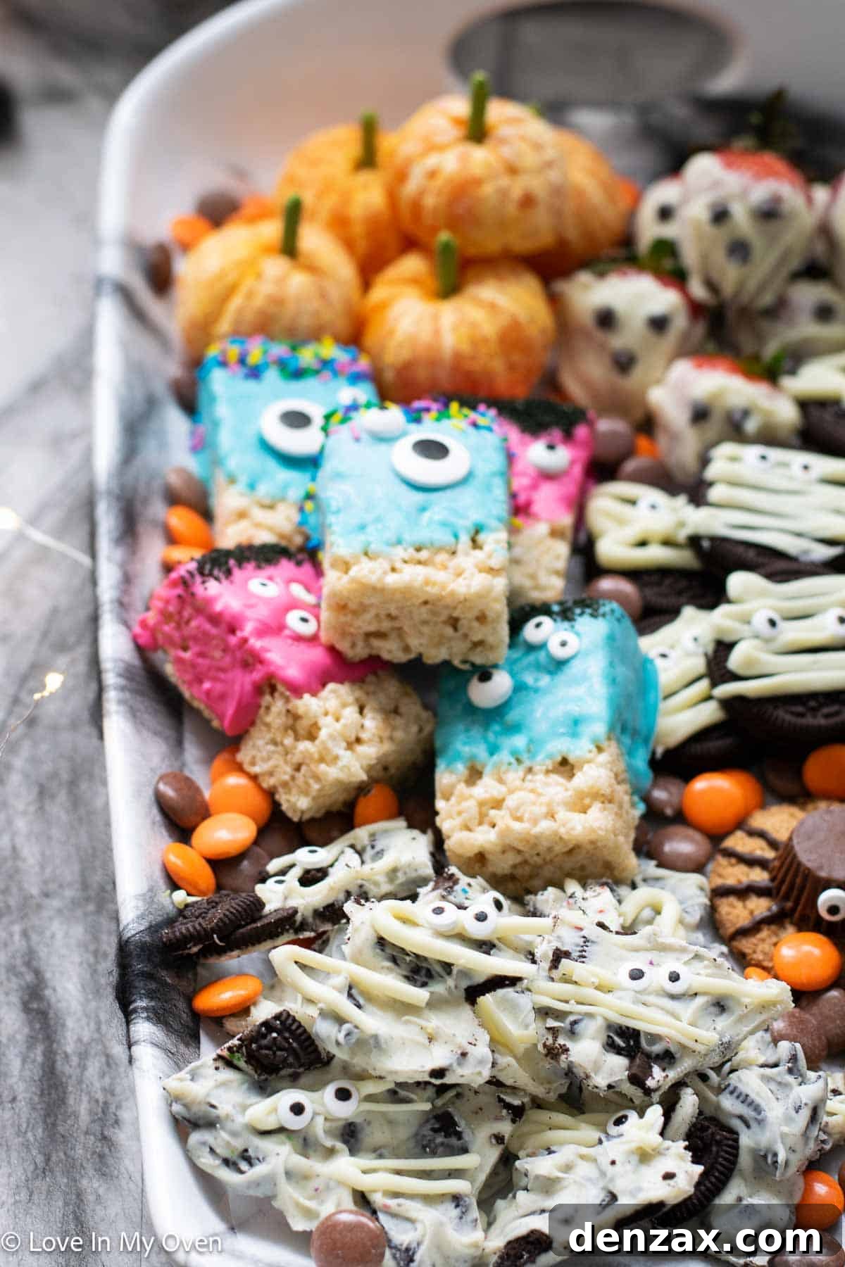 Spooky Sweet Creations for Kids 15 A vibrant Halloween dessert platter filled with various easy 3-ingredient treats for kids, ready for a party.