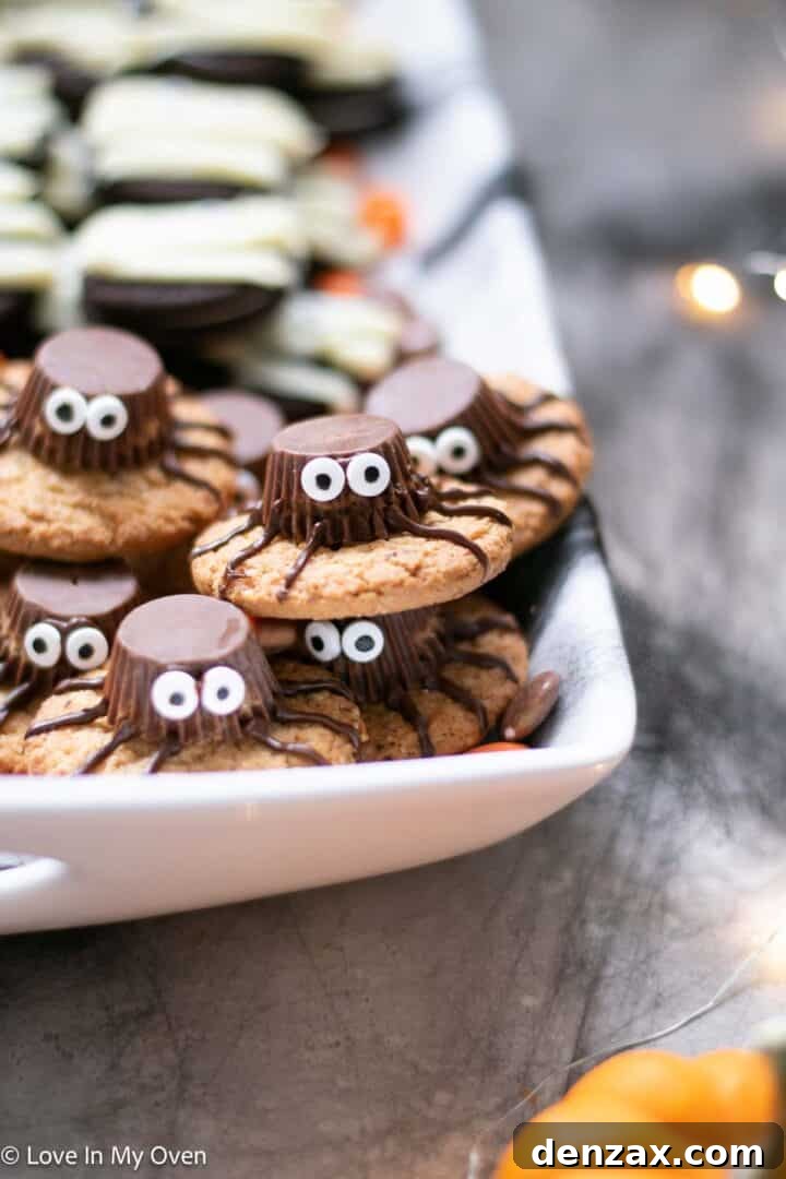 Spooky Sweet Creations for Kids 4 Peanut Butter Spider Cookies decorated with mini Reese's and chocolate legs on a Halloween platter.
