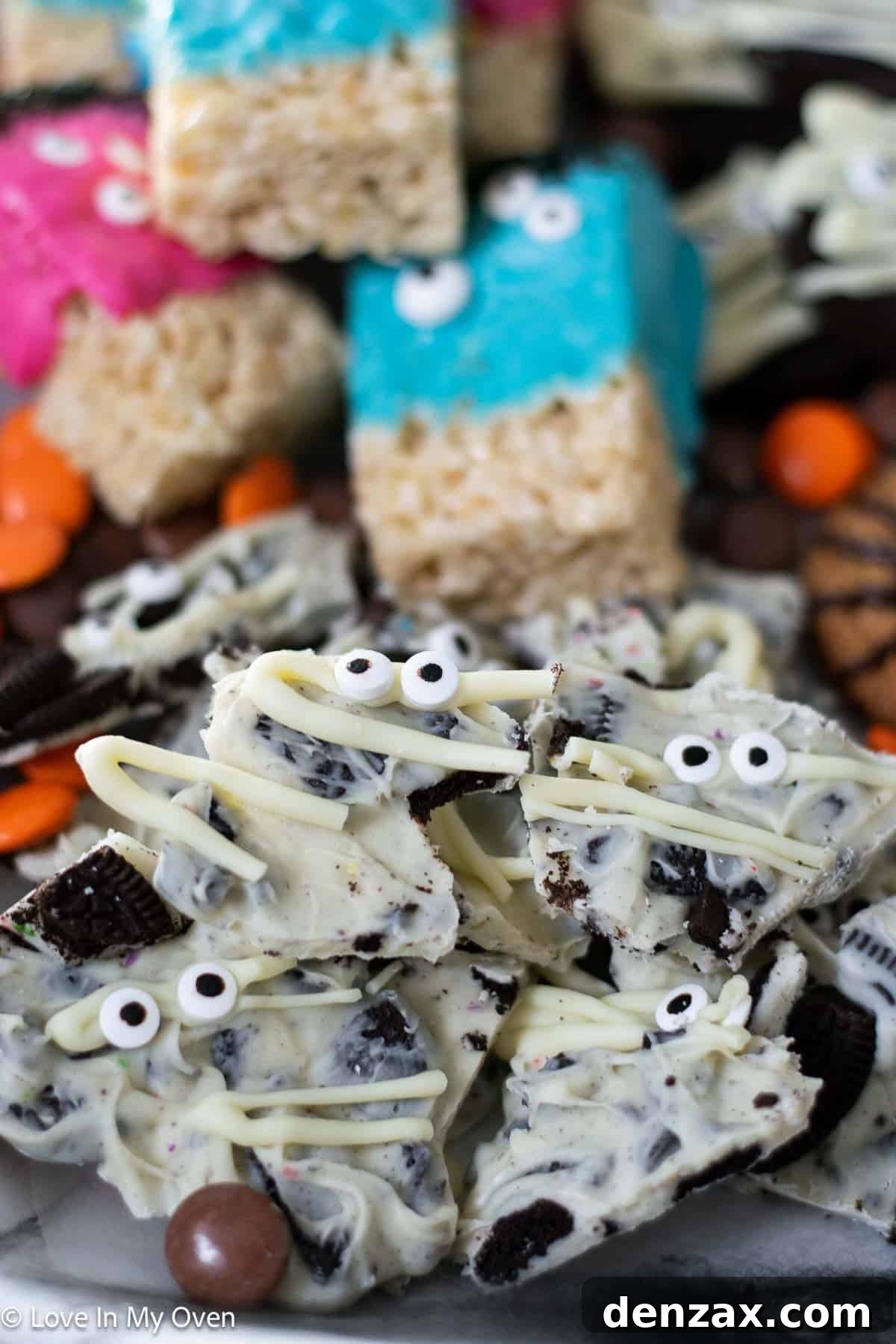 Spooky Sweet Creations for Kids 6 Mummy Cookies and Cream Bark, a white chocolate treat with Oreo pieces and candy eyeballs, on a Halloween themed background.