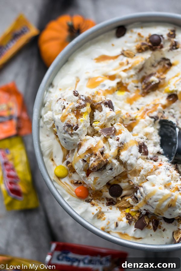 Scoops of Halloween ice cream garnished with candy in a bowl