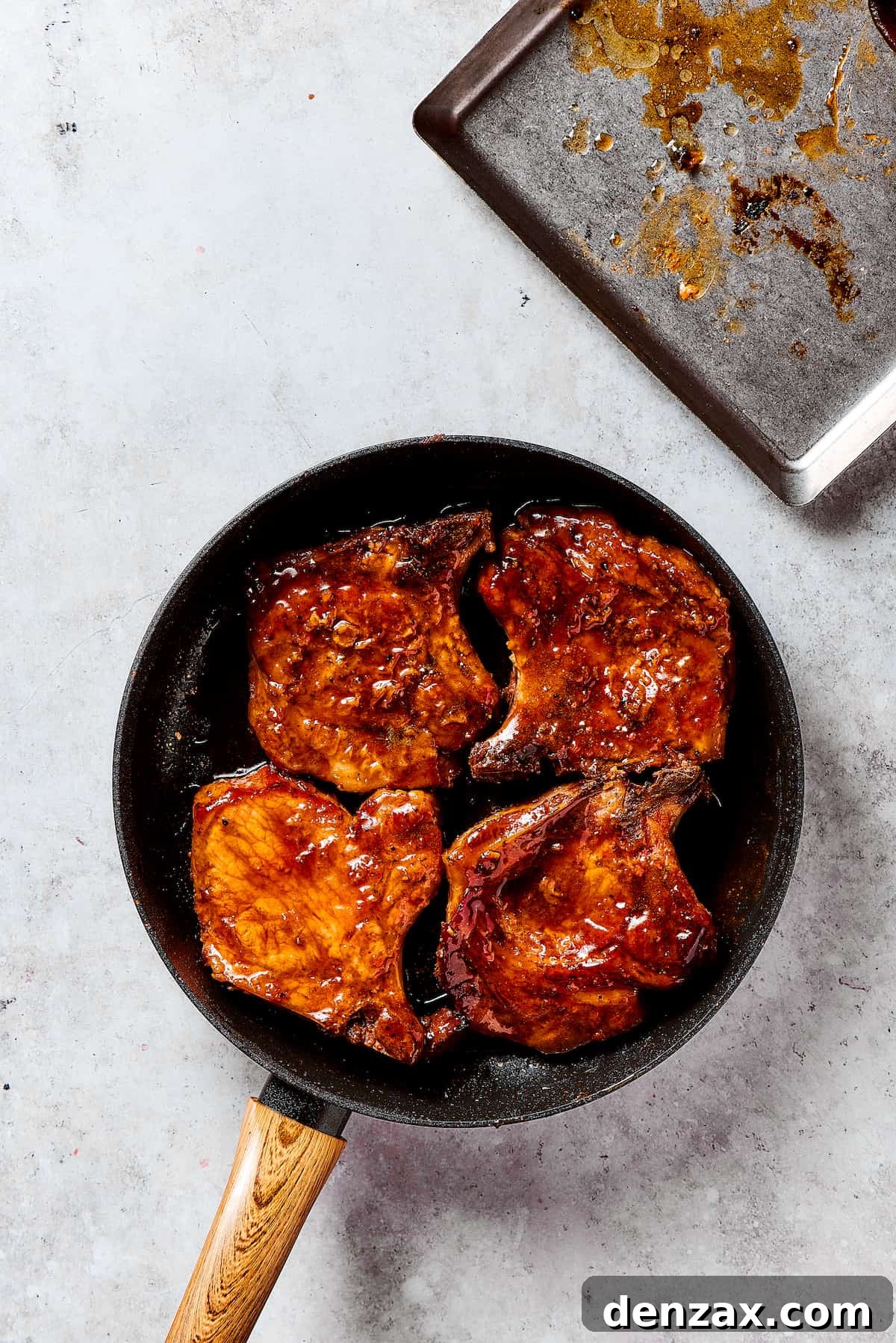 Gorgeous Brown Sugar Pork Chops may look fancy, but they are actually so simple to make! Savory, pan-fried chops with brown sugar glaze. Glazing the pork chops in the brown sugar sauce.
