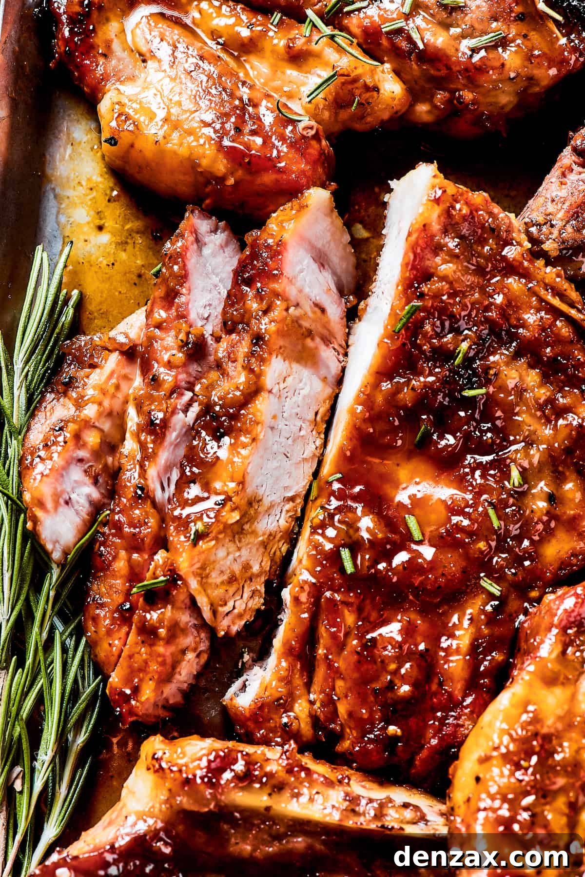 Gorgeous Brown Sugar Pork Chops may look fancy, but they are actually so simple to make! Savory, pan-fried chops with brown sugar glaze. A pork chop sliced to show the perfectly cooked interior.