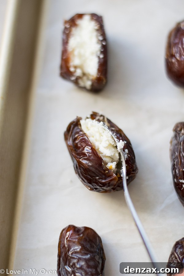 Dates being sliced lengthwise with a paring knife to remove pits for stuffing.