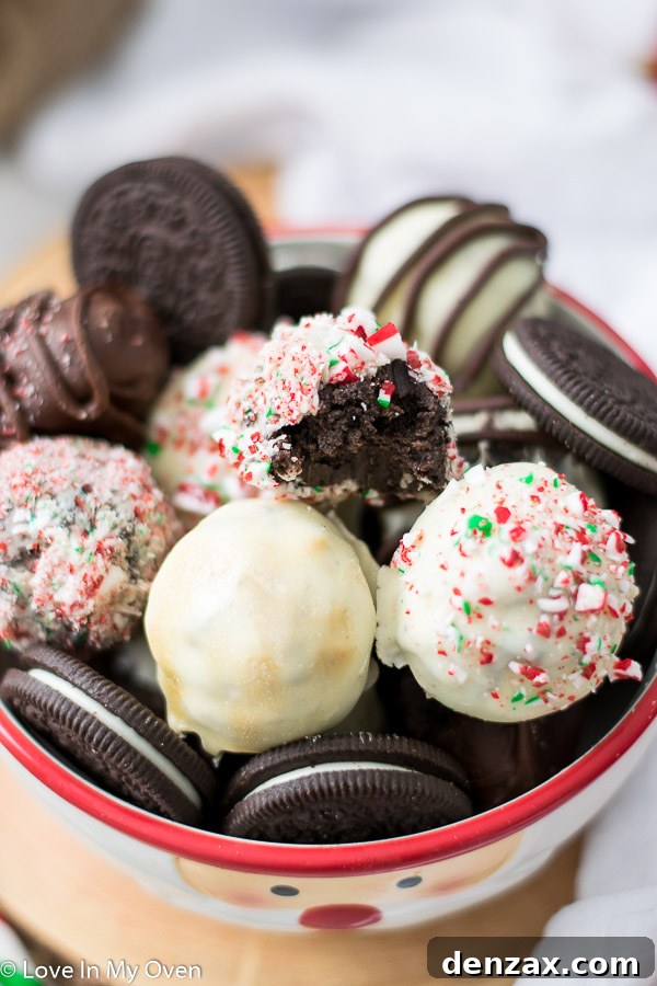 Several three ingredient Oreo truffles artfully arranged on a white platter