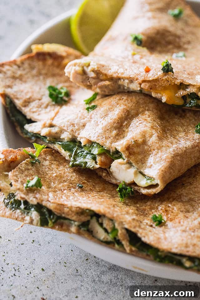 Close up of perfectly baked chicken and cheese quesadillas.