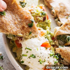Dipping a quesadilla in sour cream and quac.