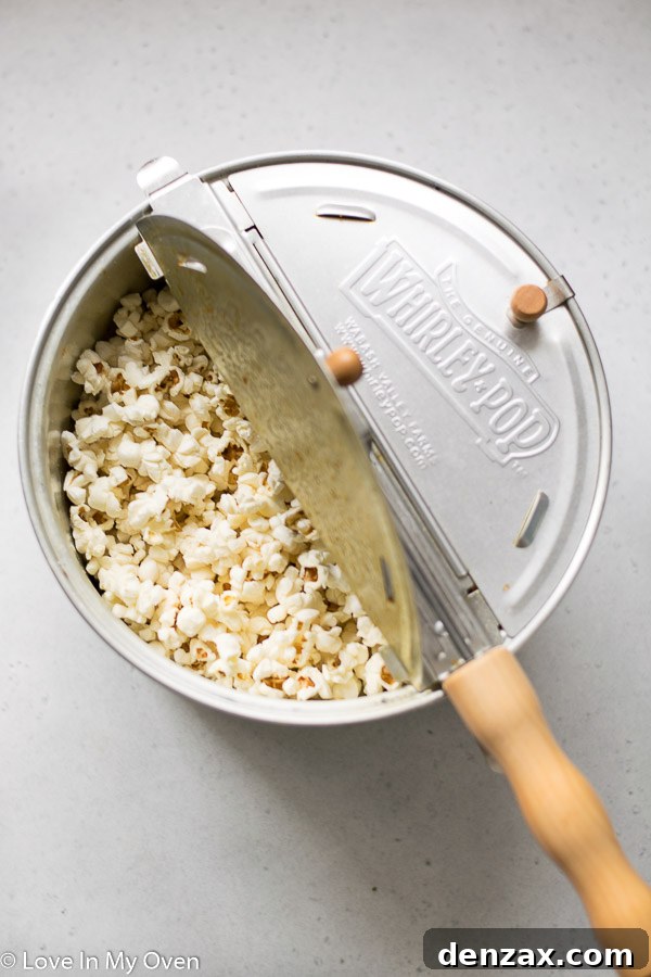 Bowl of freshly popped popcorn, ready to be coated with healthy caramel sauce.