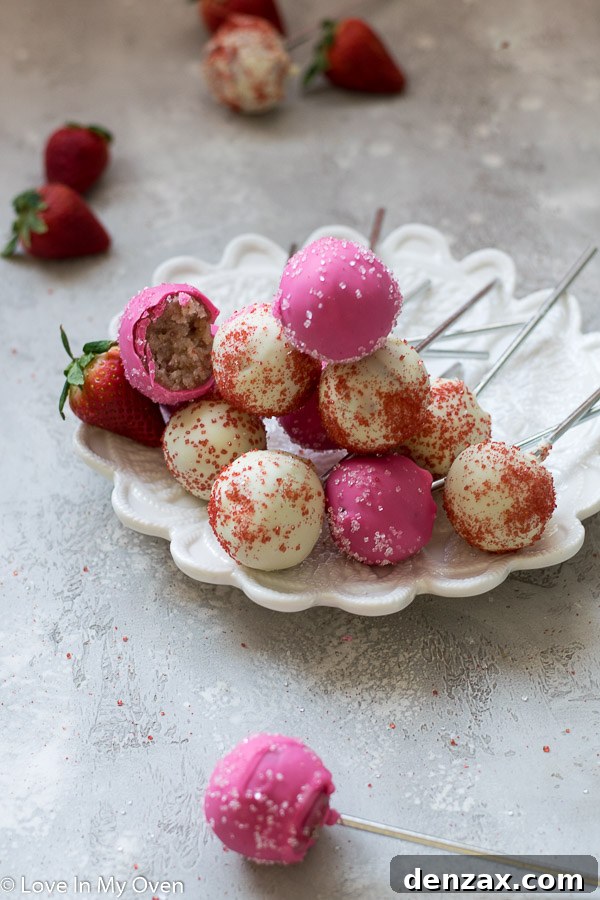 Basket of assorted strawberry cake pops with various toppings