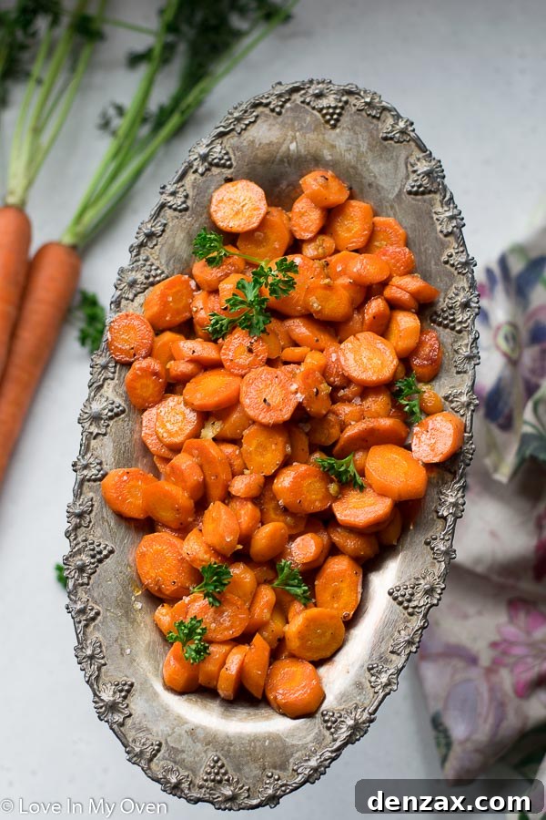 Garlic Butter Roasted Carrots close up, showing crispy edges and minced garlic