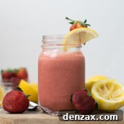 Small jar of homemade strawberry lemon curd, ready for a recipe.