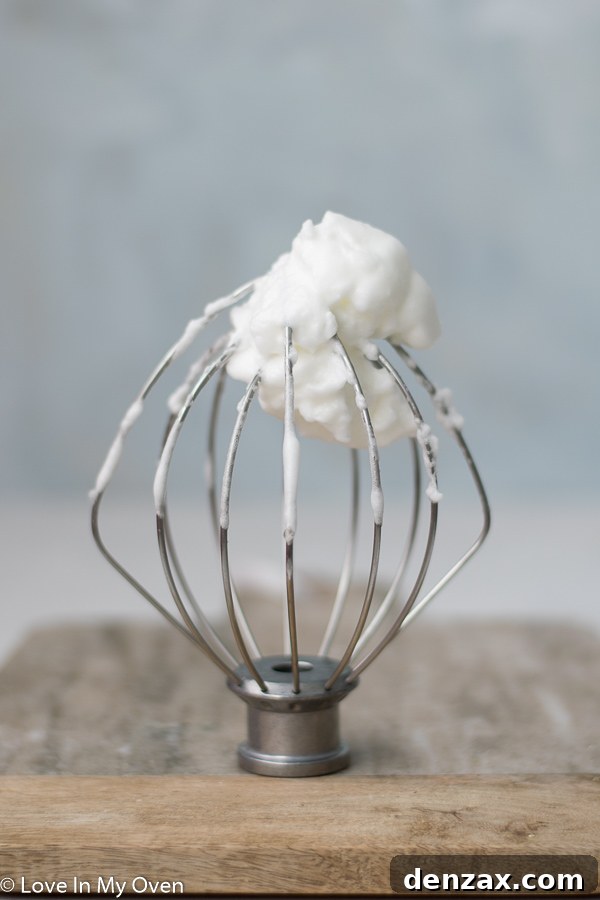 Egg whites whipped to soft peaks, foamy and tripled in volume