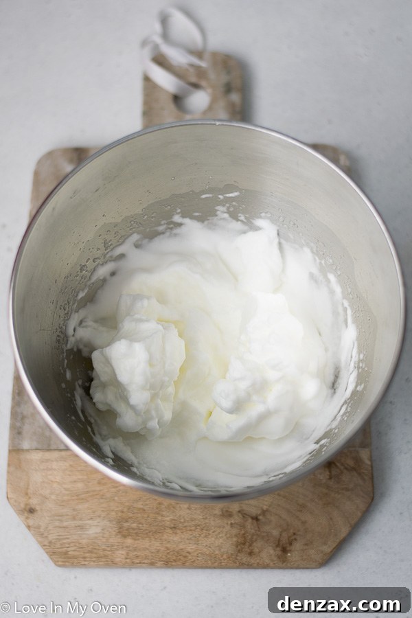 Transition from soft peaks to adding sugar for meringue